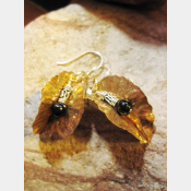 Tribal fold form bronze leaf earrings with sterling and black onyx