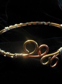 Upper Arm cuff bracelet of copper, brass, and silver wire.