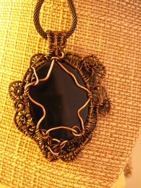 Copper black onyx tree of life with a swirling spirals wire woven pendant one of