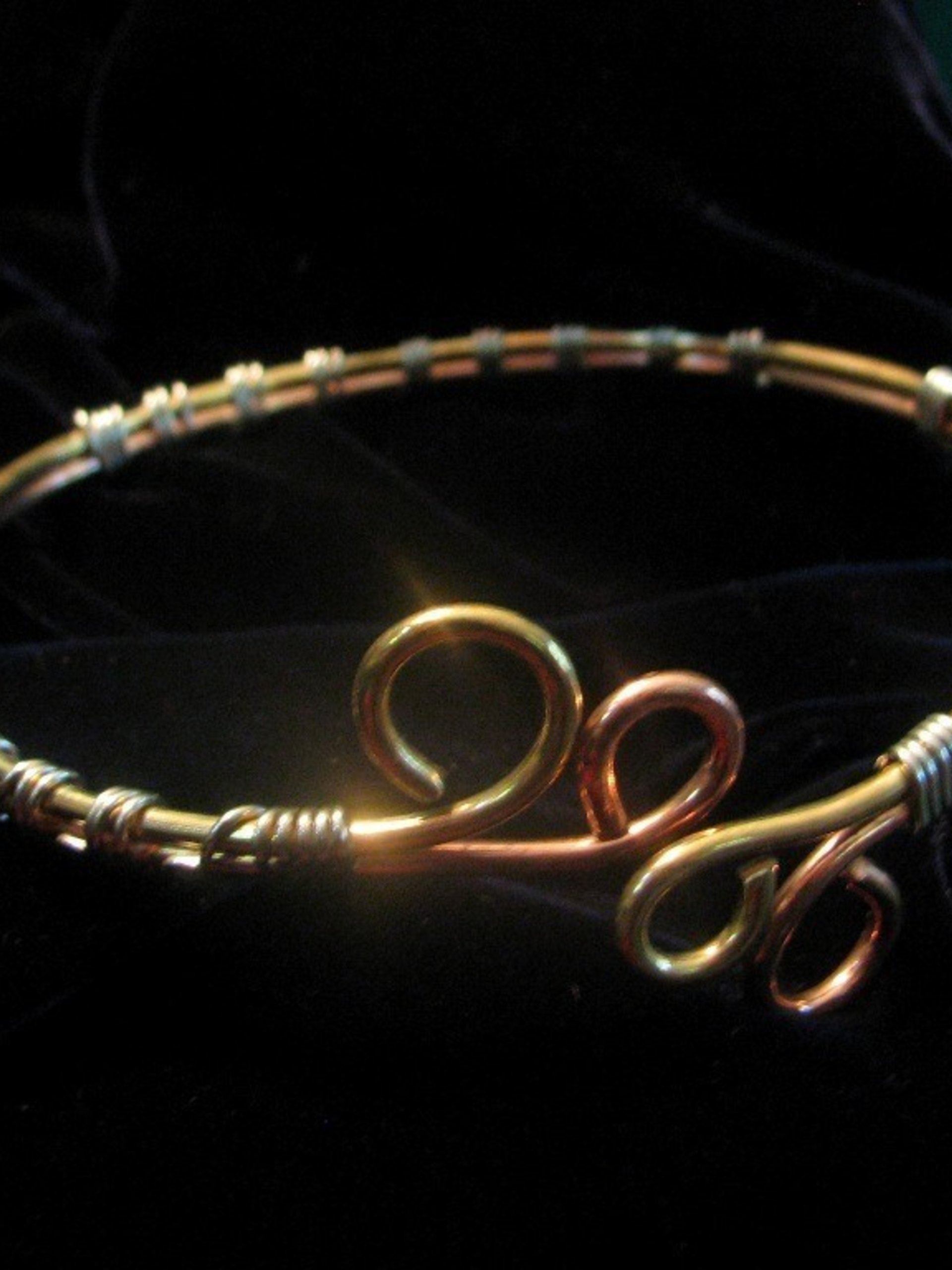Upper Arm cuff bracelet of copper, brass, and silver wire.
