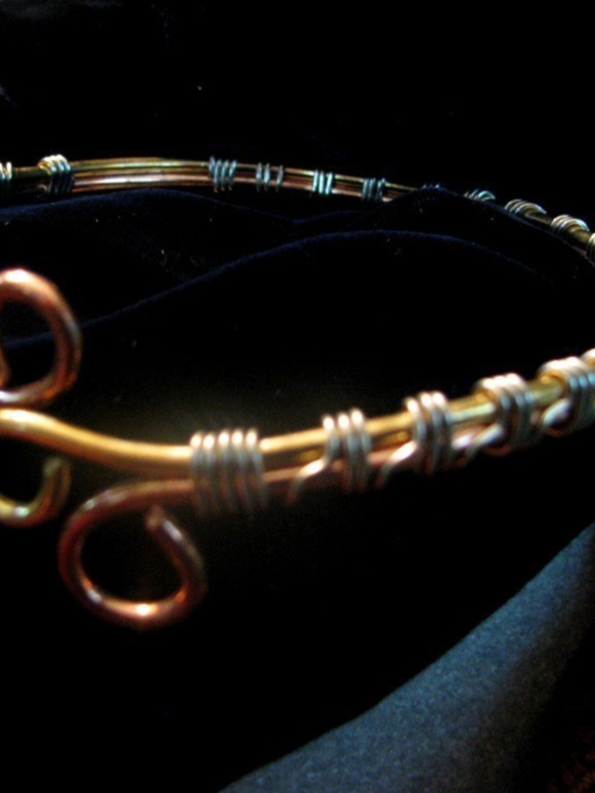 Upper Arm cuff bracelet of copper, brass, and silver wire.