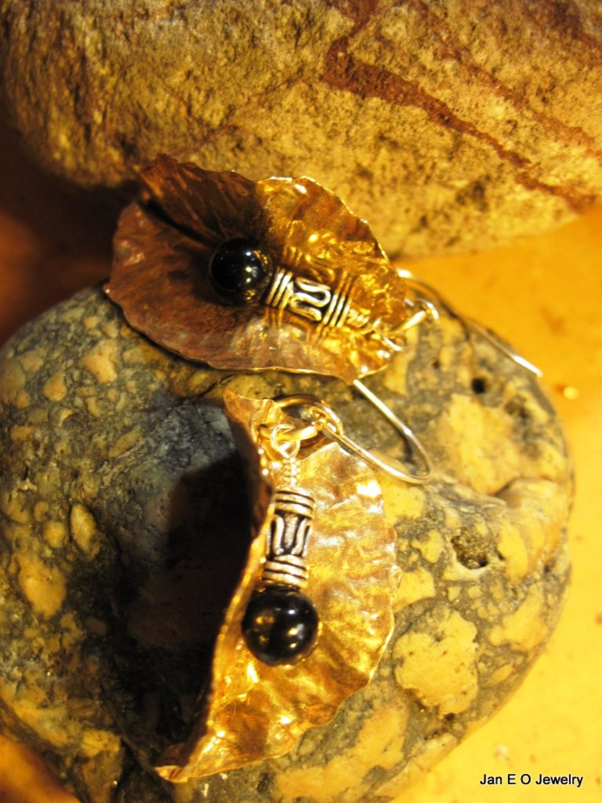 Tribal fold form bronze leaf earrings with sterling and black onyx