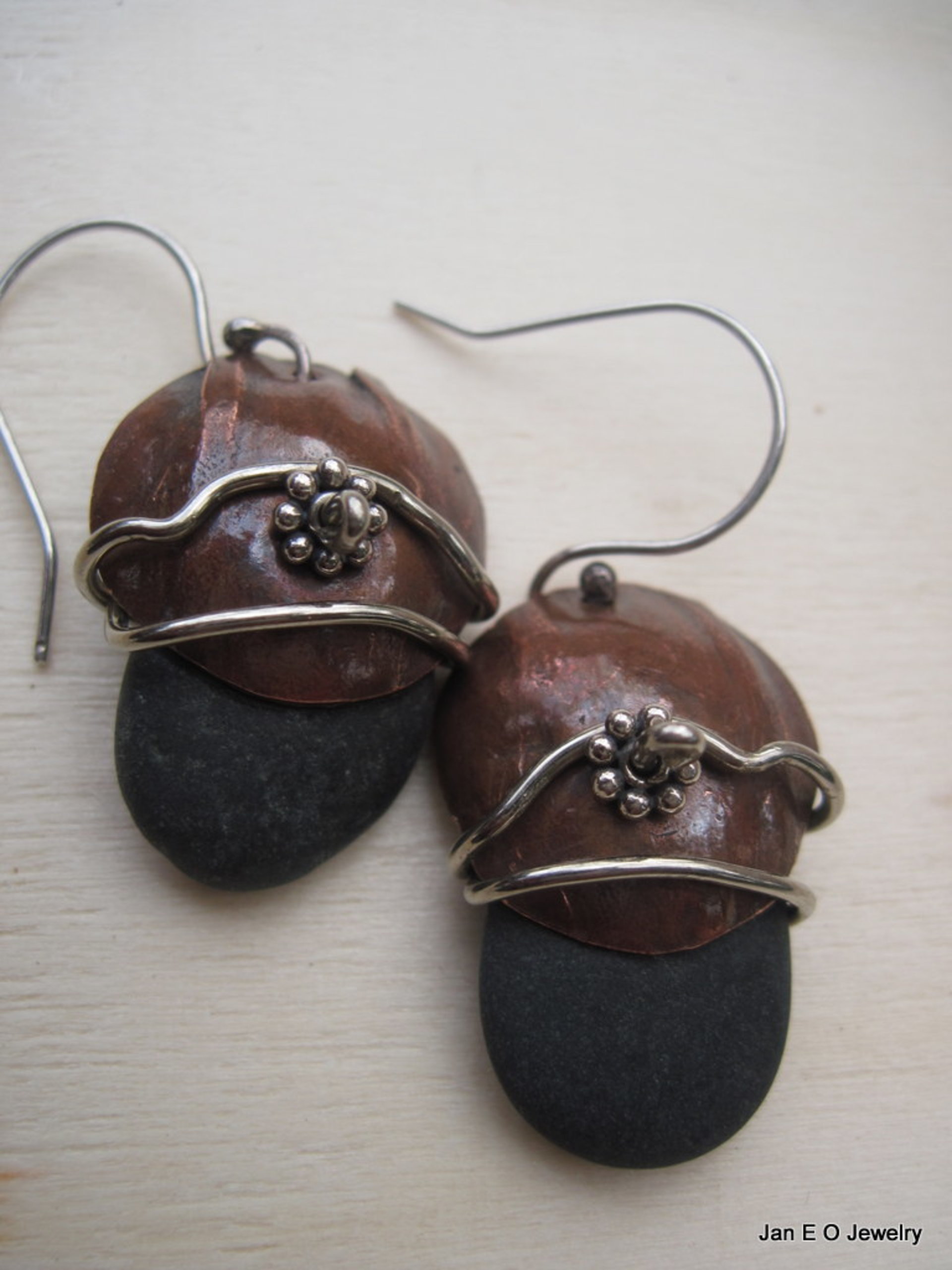 Natural beach stone and copper Om rock earrings